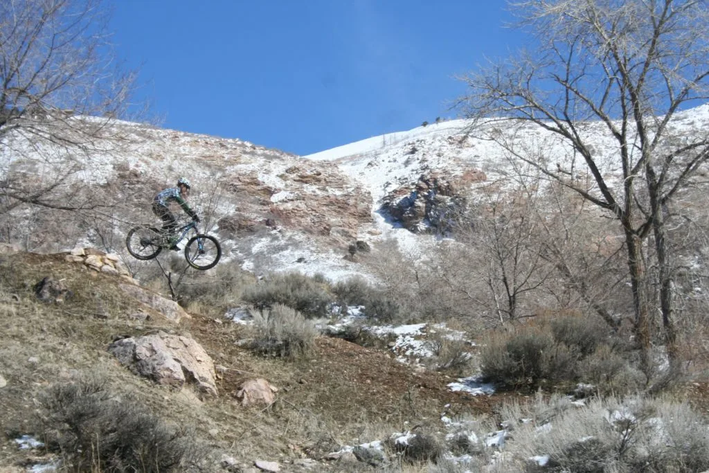Jim-E jumping a mountain bike at Ogden bike park